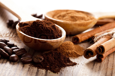 coffee-beans-and-cinnamon-milled-closeup-in-wooden-spoons